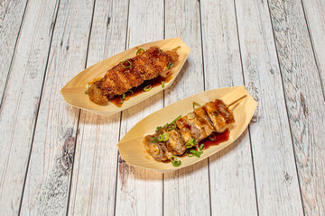 Asian skewers on wooden saucers
