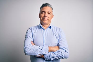 Middle age handsome grey-haired business man wearing elegant shirt over white background happy face...