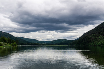 Fototapeta na wymiar Storm clouds over paul lake british columbia canada.