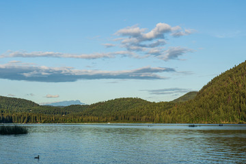 beautiful day at paul lake with blue sky and white clouds british columbia canada.