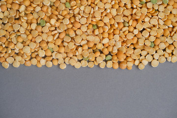 Dry peas beans close up on grey background. Healthy eating, useful beans.