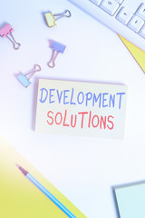 Conceptual hand writing showing Development Solutions. Concept meaning Efficient Planning based on...