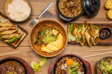 dishes of ramen and asian food