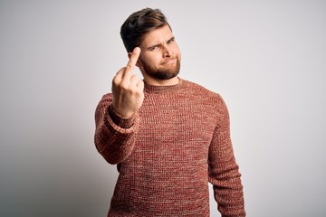 Young blond man with beard and blue eyes wearing casual sweater over white background Showing...