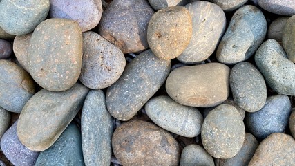 Fototapeta na wymiar pile of color pebble stones background