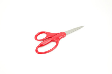 Red scissors isolated on white background. Close up with detail metal blades texture.