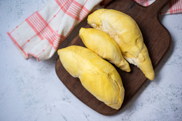 Durian fruit fresh from tree peel on wooden board - Ripe durian tropical fruit summer for sweet dessert or snack in Thailand