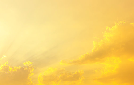 Bright Yellow Sun Light In Sky With Clouds