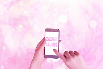 Writing note showing Development Solutions. Business concept for Efficient Planning based on the...