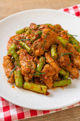 Stir fried pork and red curry paste with sting bean