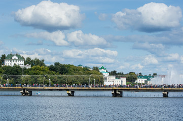 bridge over the bay with many people on theday of the celebration of the 550th anniversary  of the city of Cheboksary in 2019. Mass festivities in the Chuvash Republic in 2019.