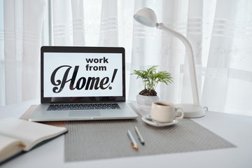 Work from home advice on screen of opened laptop of person working from home during quarantine