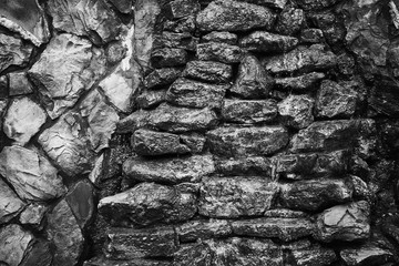 Water flows down a stone wall.