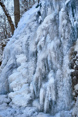 Icy waterfall on a mountain river.