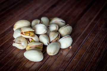 Close view of roasted, salted pistachios. Use for healthy snack concept.