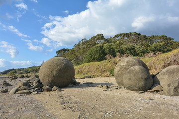 Round stones of Koutu Boulders on the beach, New Zealand