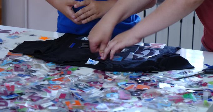 Alphabets arranging on t-shirt for printing closeup
