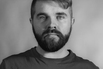 Hipster man portrait in black and white in horizontal composition.