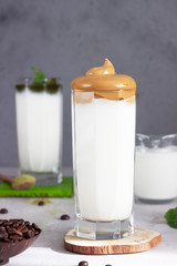 Dalgona coffee and matcha latte with mint, fluffy creamy whipped coffee with bamboo straws. Trend Korean coffee drink. 