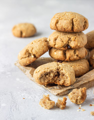 Homemade vegan cookies with buckwheat, raisin and nuts. Healthy sweet snack. Light grey stone background. 