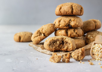 Homemade vegan cookies with buckwheat, raisin and nuts. Healthy sweet snack. Light grey stone background