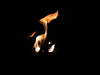 Abstract, bonfire with flame in the dark.