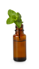 Bottle with mint essential oil on white background
