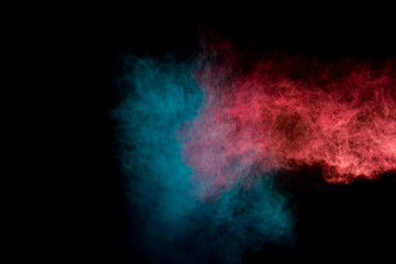 Colorful powder explosion on black background. Colorful dust explode. Paint Holi.