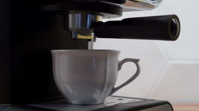 Coffee making machine in action.
