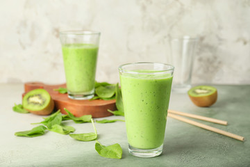 Glasses of healthy smoothie on table