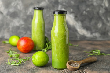 Bottles of healthy smoothie on table