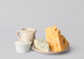 Different dairy products without lactose on grey background