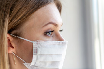 Nurse or doctor with face mask. Close up portrait of young caucasian woman model