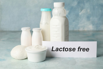 Different dairy products without lactose on color background