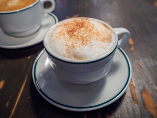 A cup of cappuccino isolated from top view