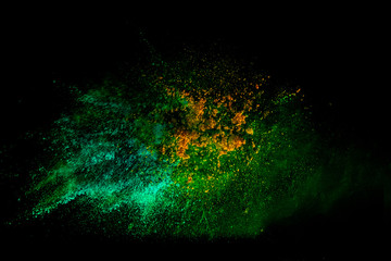 Colorful powder explosion on black background. Colorful dust explode. Paint Holi.