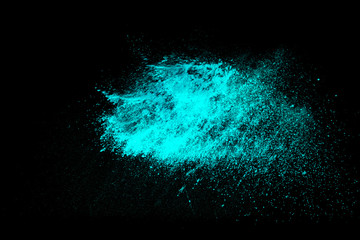 Colorful powder explosion on black background. Colorful dust explode. Paint Holi.