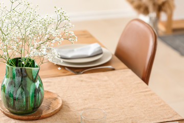 Fototapeta na wymiar Served table in modern dining room