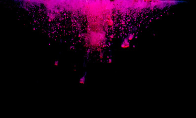 Colorful powder explosion on black background. Colorful dust explode. Paint Holi.