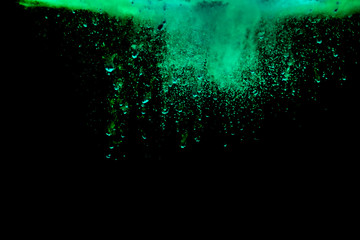 Colorful powder explosion on black background. Colorful dust explode. Paint Holi.