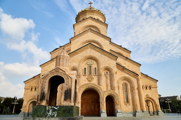 Fototapeta premium Big orthodox cathedral St. Trinity or Chirch Sameba in Tbilisi city in Georgia and blue sky background