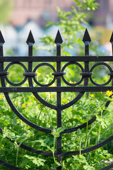 Metal fence of the green square in Jewish district Kazimierz on Szeroka street, elements of Jewish symbolism, Krakow, Poland