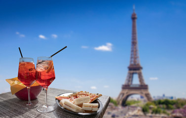 Aperitif in front of the Eiffel Tower in Paris - Cocktail for two with sandwiches for a relaxing holiday