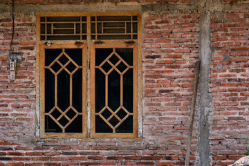 old brick wall with windows