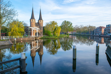 A view from the canal of the Oostpoort (east gate) in the city of Delft.
