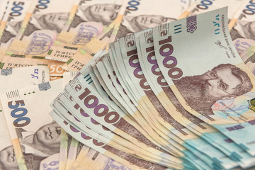 seamless texture of real new ukraine 500 and 1000 banknotes. Pile of hryvnia as financial background.