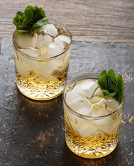 Glass of rum on the wooden background, Cuba Libre or long island iced tea cocktail with strong drinks
