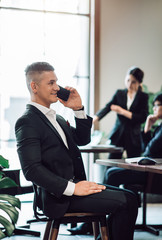 Caucasian Businessman Using Smartphone to Tele Conference with Partner - Telecommunications Technology Concept