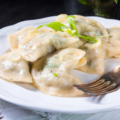 Polish pierogi filled with ramsons pesto