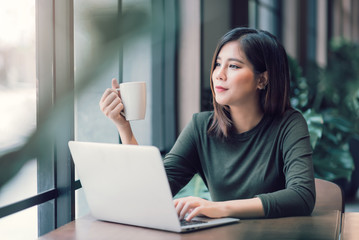 Beautiful Asian Woman Using Laptop Computer Online Working from Home ,  E-Learning , Online...